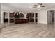 Spacious open kitchen with dark wood cabinetry, an island with bar seating, and modern appliances at 14674 W Pasadena Ave, Litchfield Park, AZ 85340