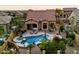 Expansive backyard with a pool, spa, fire pit, and covered patio, perfect for outdoor living and entertaining at 1641 N Channing --, Mesa, AZ 85207