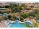 Spacious backyard featuring a pool, spa, fire pit, and well-maintained landscaping, providing a serene escape at 1641 N Channing --, Mesa, AZ 85207