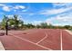 Outdoor basketball court with a vibrant red surface and clear white lines for recreational play at 1641 N Channing --, Mesa, AZ 85207