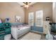 Cozy bedroom with wood-look floors, soft colors, and a daybed, perfect for a room or guest space at 1641 N Channing --, Mesa, AZ 85207