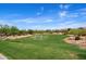 Community park with a grassy field, soccer goal, and desert landscaping, perfect for recreation and outdoor activities at 1641 N Channing --, Mesa, AZ 85207