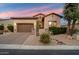 Beautiful exterior view of a single-story house with well-maintained landscaping, stone accents, and a brick driveway at 1641 N Channing --, Mesa, AZ 85207