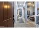 Inviting foyer with arched doorways, neutral paint, tiled floors, and a clear view into the dining area at 1641 N Channing --, Mesa, AZ 85207