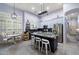 Well-designed kitchen featuring a central island with seating, stainless steel appliances, and blue cabinetry at 1641 N Channing --, Mesa, AZ 85207