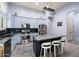 Updated kitchen featuring granite countertops, stainless steel appliances, a central island, and stylish cabinetry at 1641 N Channing --, Mesa, AZ 85207