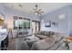 Relax in this inviting living room with plush sectional, stylish decor, and abundant natural light from large windows at 1641 N Channing --, Mesa, AZ 85207