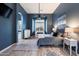Serene main bedroom retreat with wood floors, a ceiling fan, and a cozy sitting area with large windows at 1641 N Channing --, Mesa, AZ 85207