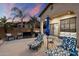 Outdoor patio with grill, lounge chairs, umbrellas, and seating area for entertaining at 1641 N Channing --, Mesa, AZ 85207