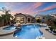Lush backyard oasis with pool, spa, covered patio, and outdoor kitchen, great for entertaining at 1641 N Channing --, Mesa, AZ 85207
