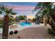 Inviting pool area with ample seating, fire pit, and lush landscaping, creating a backyard oasis at 1641 N Channing --, Mesa, AZ 85207