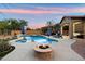 Beautiful backyard pool and spa area featuring a fire pit and outdoor seating at 1641 N Channing --, Mesa, AZ 85207