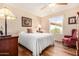 Bright bedroom with wood floors, a ceiling fan, ample natural light, and tasteful decor at 1703 Leisure World --, Mesa, AZ 85206