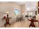 Bright breakfast nook with a cozy table set, and a large window offering pleasant outdoor views at 1703 Leisure World --, Mesa, AZ 85206