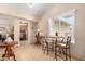 Cozy breakfast nook featuring a small table, chairs, and ample natural light streaming through a large window at 1703 Leisure World --, Mesa, AZ 85206