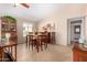 Traditional dining area features a wooden table set and built in hutch with beautiful decorations, art and tile floors at 1703 Leisure World --, Mesa, AZ 85206