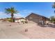 Charming single-story home featuring a well-maintained yard with desert landscaping and a two-car garage at 1703 Leisure World --, Mesa, AZ 85206