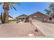 Charming single-story home featuring a well-maintained yard with desert landscaping and a two-car garage at 1703 Leisure World --, Mesa, AZ 85206