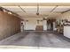 Spacious garage with laundry area, built in cabinets, and room for storage at 1703 Leisure World --, Mesa, AZ 85206