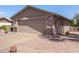 Charming single-story home featuring a well-maintained yard with desert landscaping and a two-car garage at 1703 Leisure World --, Mesa, AZ 85206