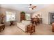 Bright and spacious living room with dining area featuring tile floors, neutral paint, and ample natural light at 1703 Leisure World --, Mesa, AZ 85206
