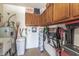 Functional storage room with cabinetry, a water heater, and ample space for tools and equipment at 1703 Leisure World --, Mesa, AZ 85206
