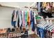 Well-organized walk-in closet with ample hanging space and shelving for shoes and accessories at 1703 Leisure World --, Mesa, AZ 85206