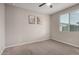Neutral bedroom with carpet and natural light from the window at 17437 W Via De Luna Dr, Surprise, AZ 85387