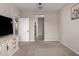 Neutral bedroom with a ceiling fan and easy access to other rooms at 17437 W Via De Luna Dr, Surprise, AZ 85387