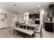 Open concept dining room with a wood table and view of the kitchen at 17437 W Via De Luna Dr, Surprise, AZ 85387