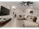 Comfortable living room featuring neutral walls and hard surface floors at 17437 W Via De Luna Dr, Surprise, AZ 85387