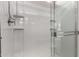 Clean shower with white tile and glass door at 17437 W Via De Luna Dr, Surprise, AZ 85387