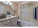 Contemporary bathroom featuring modern fixtures and a sleek glass shower enclosure at 17668 N Del Webb Blvd, Sun City, AZ 85373