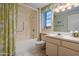Well-lit bathroom with a shower-tub combo and decorative shower curtain at 17668 N Del Webb Blvd, Sun City, AZ 85373