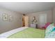 Cozy bedroom with green bedding, a comfortable atmosphere, and a relaxing space with natural light at 17668 N Del Webb Blvd, Sun City, AZ 85373