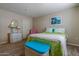 Charming bedroom with white wicker furniture, art and bright accessories at 17668 N Del Webb Blvd, Sun City, AZ 85373