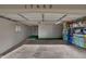 Attached garage with built-in storage cabinets and a small window, perfect for parking and organizing at 17668 N Del Webb Blvd, Sun City, AZ 85373