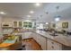 Bright kitchen with white cabinets, granite countertops, and modern appliances, perfect for cooking at 17668 N Del Webb Blvd, Sun City, AZ 85373