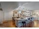 Bright open kitchen with granite counters, stainless appliances, a large island, and modern lighting at 17668 N Del Webb Blvd, Sun City, AZ 85373