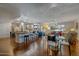 Open-concept living area with a dining area, a large kitchen, and a seamless flow at 17668 N Del Webb Blvd, Sun City, AZ 85373
