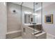 Contemporary bathroom featuring a glass shower, dual sinks, and sleek, modern design at 17831 W Mission Ln, Waddell, AZ 85355