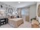 Cozy bedroom with cactus wallpaper, a large window and comfortable carpet at 17831 W Mission Ln, Waddell, AZ 85355