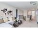 Bonus room featuring world map decor, comfortable seating and stairway view at 17831 W Mission Ln, Waddell, AZ 85355