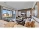 Inviting living room with a comfortable sofa, large sliding glass doors, and a view of the backyard at 17831 W Mission Ln, Waddell, AZ 85355