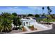 Aerial view of a charming white home with manicured landscaping and a long driveway, showcasing curb appeal at 1806 W Rosewood Ct, Chandler, AZ 85224