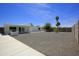 Expansive backyard features low-maintenance gravel, a covered patio, and a brick barbecue at 1806 W Rosewood Ct, Chandler, AZ 85224