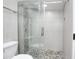 Bathroom with a glass-enclosed shower featuring stylish tilework and modern fixtures at 1806 W Rosewood Ct, Chandler, AZ 85224