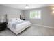 Bedroom featuring a large bed, bedside tables and a window at 1806 W Rosewood Ct, Chandler, AZ 85224