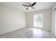 Bright bedroom with a ceiling fan, light-colored walls, and modern flooring at 1806 W Rosewood Ct, Chandler, AZ 85224