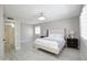 Bright bedroom with a neutral color scheme, ceiling fan, and plank flooring at 1806 W Rosewood Ct, Chandler, AZ 85224